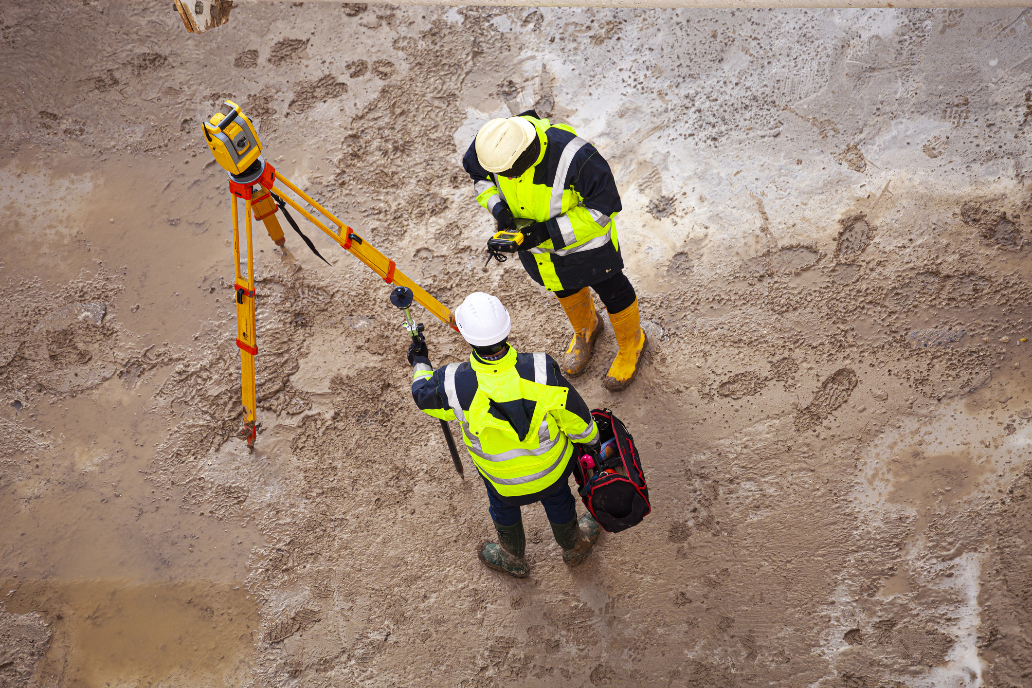 Surveyor At The Construction Site